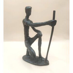 bronze sculpture of a golfer